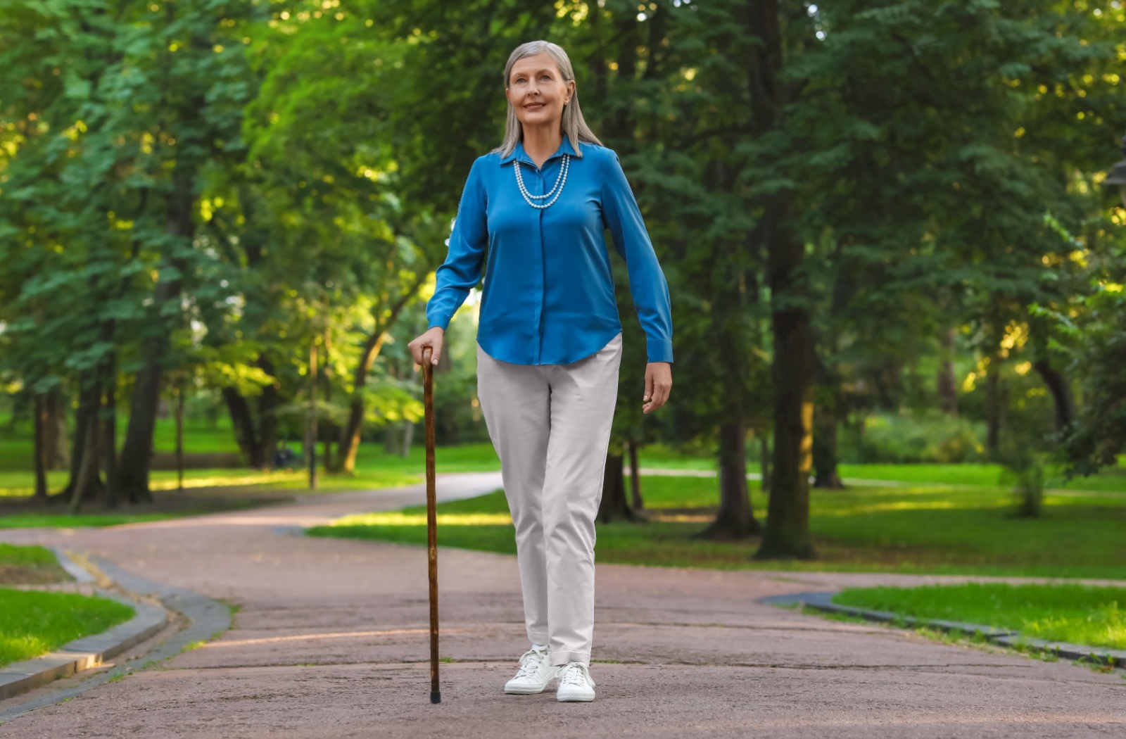 An older adult goes for an afternoon walk to help improve their sleep quality.